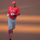 New Phillie Didi Gregorius rounds the bases wearing a mask after homering off Max Scherzer Saturday.